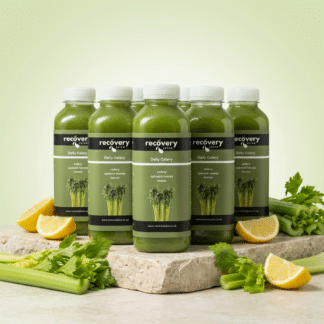 7 Day Celery Juice Cleanse with Daily Celery bottles, celery stalks and lemon on stone slab