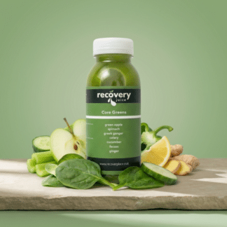 Core Greens cold-pressed green juice with apple, spinach, celery, cucumber, green bell pepper, lemon and ginger on stone slab