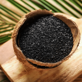 Bowl of finely powdered activated coconut charcoal, the natural detox ingredient used in our Activated Charcoal Lemonade for gentle cleansing and toxin removal.