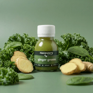 Ginger greens shot surrounded by kale, spinach and fresh ginger