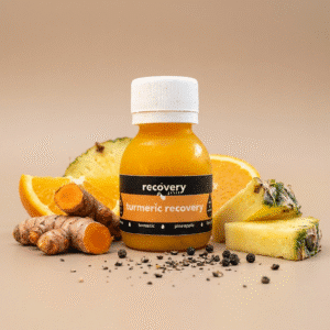 Turmeric shot ingredients including turmeric root, pineapple, orange and black pepper