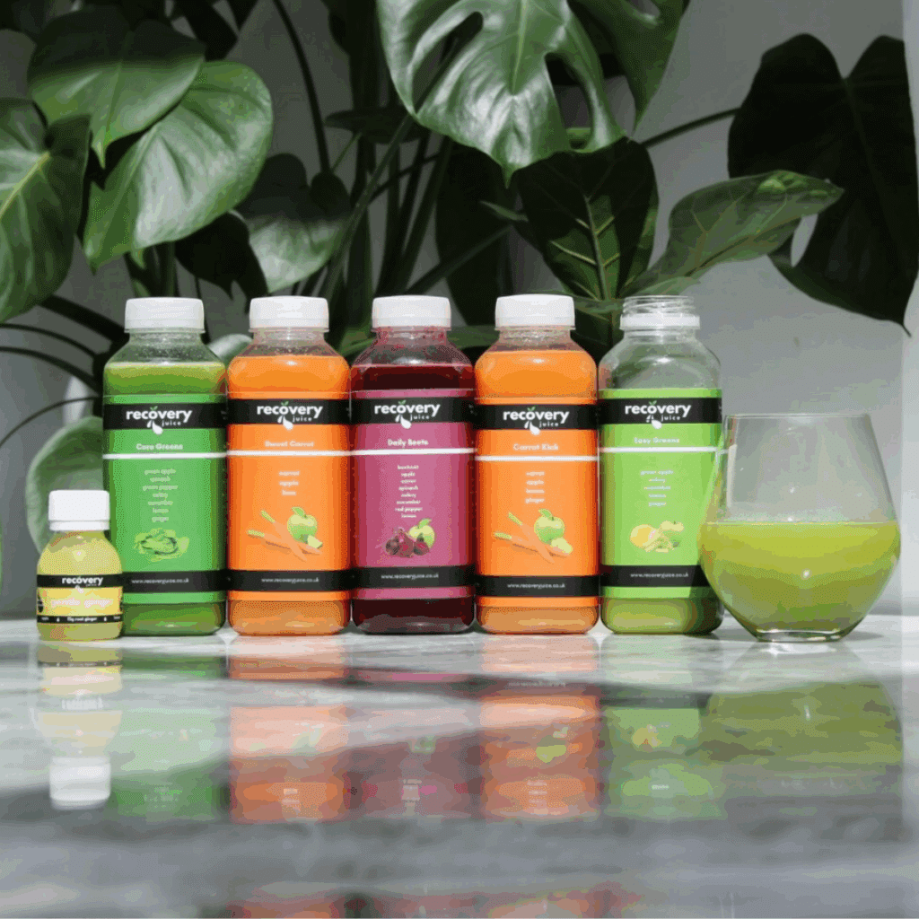Cold-pressed juice cleanse bottles on a kitchen counter – beginner-friendly detox plan with carrot, beetroot and green juices