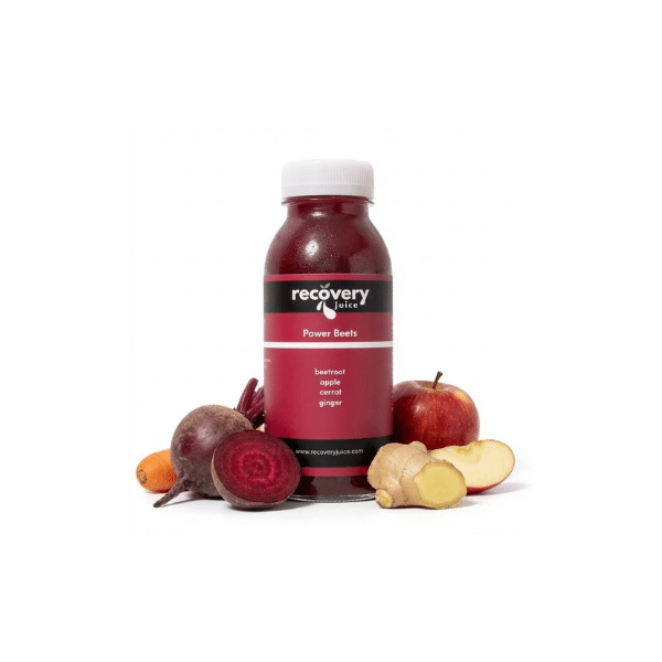 Beetroot juice bottle with fresh beetroot, apple, carrot and ginger ingredients