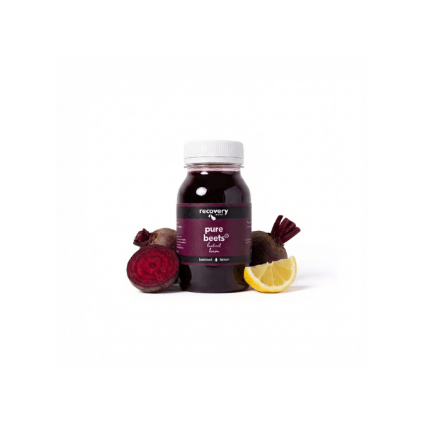 Pure beetroot juice bottle with whole beetroot and lemon ingredients