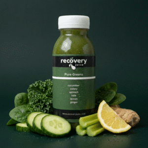 Pure Greens cold-pressed green juice with spinach, kale, cucumber, lemon and ginger displayed on a dark green background.