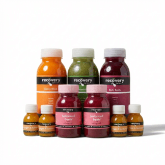 Women’s wellness juice bundle with Daily Beets, Balanced Greens, Carrot Kick, Balanced Beets and Ginger Turmeric shot on white background