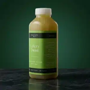 Recovery Juice Celery Twist 500ml cold-pressed juice bottle on a dark green background